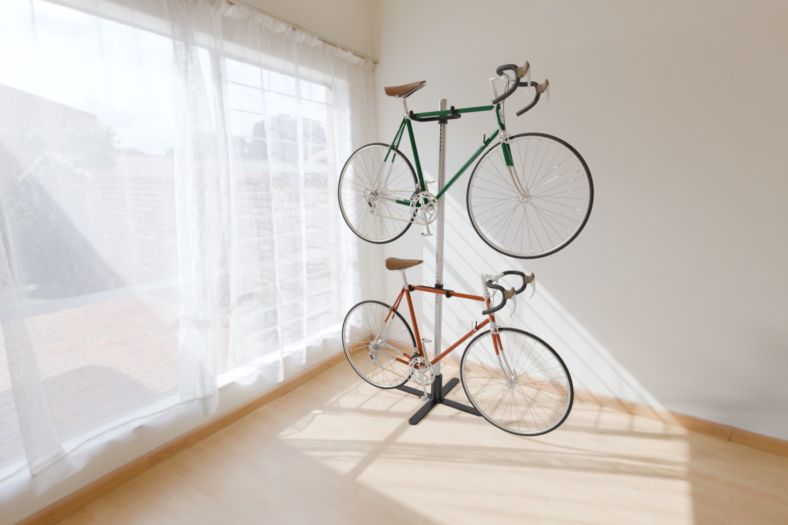 Green and clay bicycles on a silver Duo rack beside a curtained window in a sunlit room